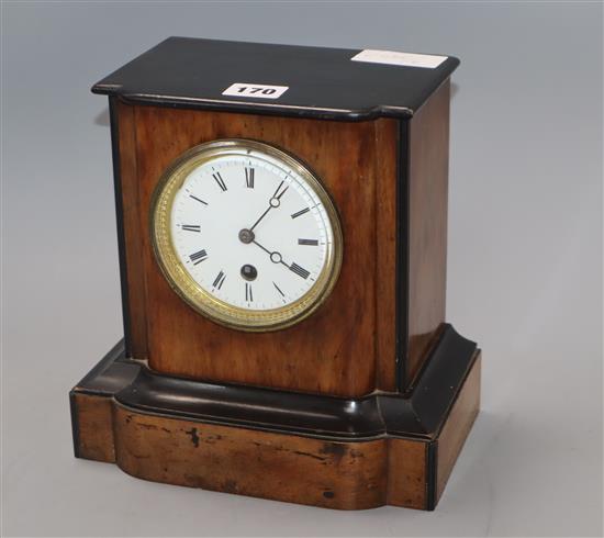 A 19th century timepiece in walnut case height 23cm